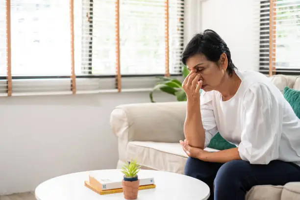 Woman experiencing memory confusion